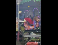 Man Reacts at Makeshift Rides in Fair