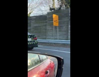 Car covered with Christmas lights and tape
