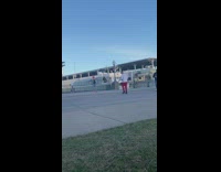 Man red cap jean jacket rap music video