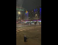 Group of people skate and bike across street