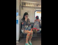 Woman plugs one nostril with finger and blows out of the other nostril