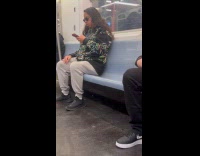 Man wears sweatshirt full of station map