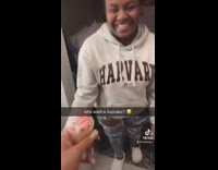 Girl replaces white frosting for pink on friends cupcake 