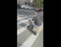 Old man drives wooden scooter bike 