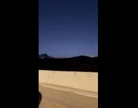 Wavy cloud trail on night sky