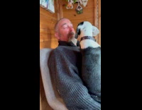 Man make mouth noises in front of dog