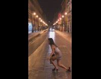 Woman grey skirt lay ground car comes