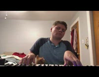 Cat steps on keys guy plays piano
