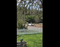 Girl sit middle road white car rural