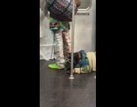 Dog wears striped scarf brown sweater subway 