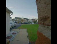 woman in blue sweater falls on front yard