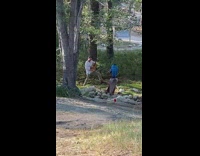 Man in white long sleeves plays and strums guitar