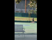 Guy black shirt spin flag basketball court