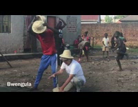 Red shirt guy switches hats while dancing