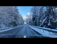 Time lapse road drive snowy surroundings mountain