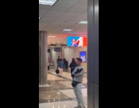 Man tiktok dance inside the airport hallway