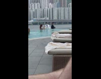 Lady at pool takes food photos and selfies 