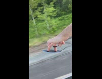 Guy finger surfs out window 