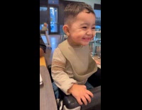 Toddler smiles to every girl that passes by