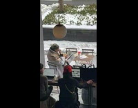 Lady Pretends to Read Newspaper for Pictures