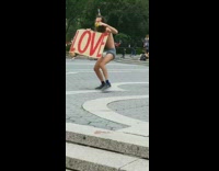 Guy cardboard love sign face mask shorts 