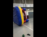 Guys tip over red inflatable bouncy house 
