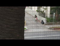 Guy steps on aluminum cans outside