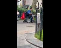 Old man on mobility scooter make bird noise