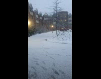 Filmer opens the door and snow falls outside everywhere