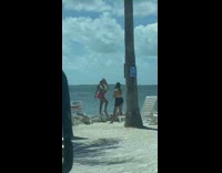 Two woman photo shoot tree beach