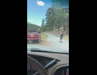 Woman sit red car window photo shoot