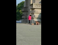 Girl pink jacket cameraman lay on floor