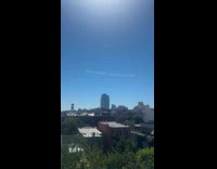 Random airplane leaves trail on the sky