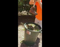 Man stomps on the garbage with its prosthetic leg