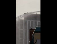 Collab Winy - Water sprays down from top of building 