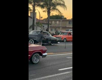 Collab IITW - Man in checkered top tiktok dance with a tripod in the middle of the street