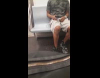 Camouflage shirt guy masturbates over shorts subway  