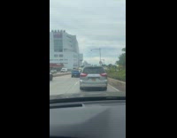 Man rides scooter on highway