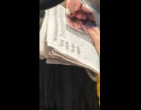 Passenger seen scribbling Trump face on newspaper