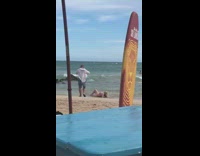 Pink bikini girl strong wave orange surfboard 