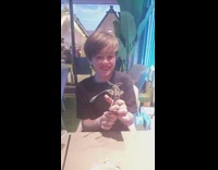 Kid playing with bottle opener