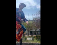 Man rides giraffe unicycle at bike lane