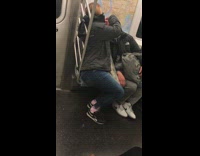 woman picking at bald mans head