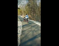 Mom skateboards and pushes baby stroller