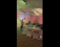 Only one couple on dance floor dancing to music at wedding prom event 