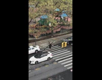 Man Drags Large Cross on Street 