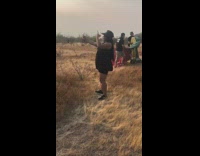 Woman black dress selfie dance wine glass