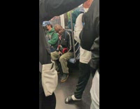 Guy bops head to necklace speaker 