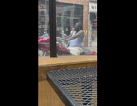 Man drive red motorcycle play loud music