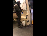 Man lifts up shirts and reveals belly on metro train